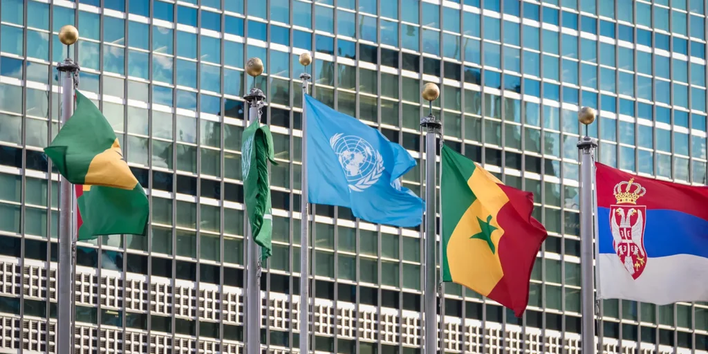 United Nations headquarters in New York with international flags during the UN Secretary-General race